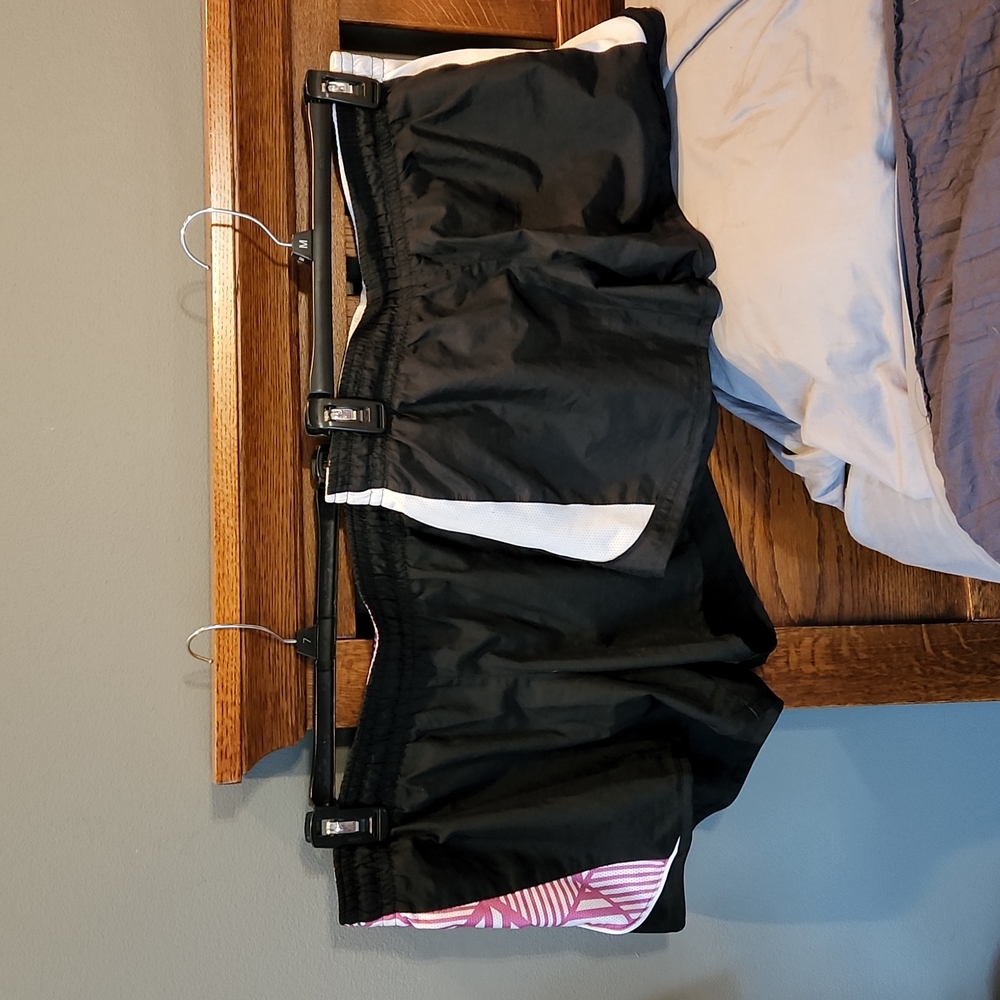 2 pairs of Nike athletic shorts,  both size medium.